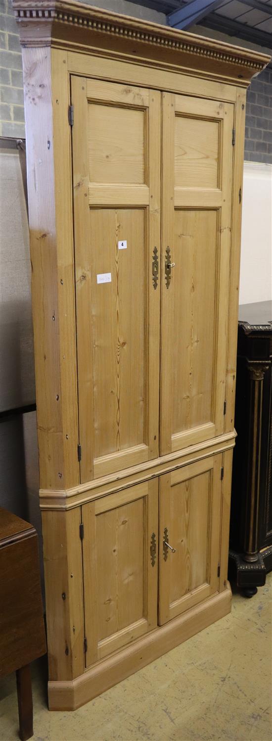 A 19th century pine four door standing corner cabinet, W.98cm